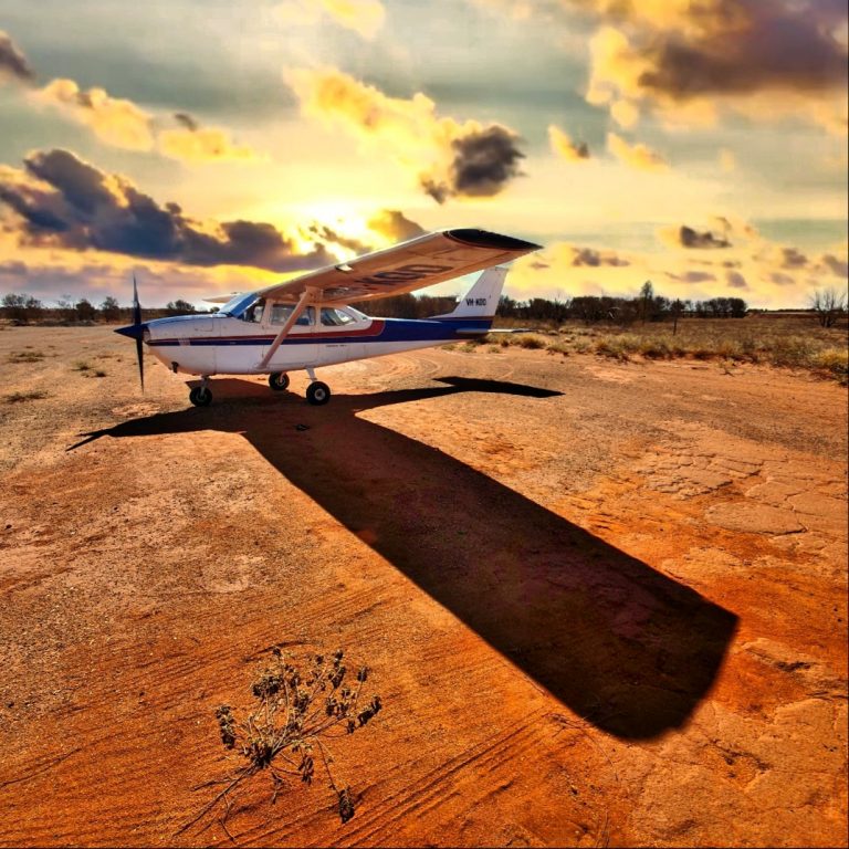 Balam Air Aircraft Wing View Against Sunset.