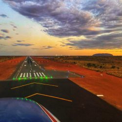 Approaching Sunset Uluru. Fifo Air Charter Ayers Rock - Alice Springs.